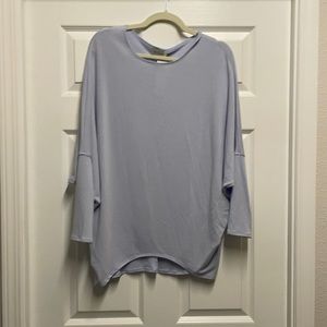 Light blue top.
